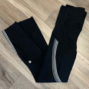 Lululemon Black HighWaisted Leggings with Silver Stripes great condition Size 2